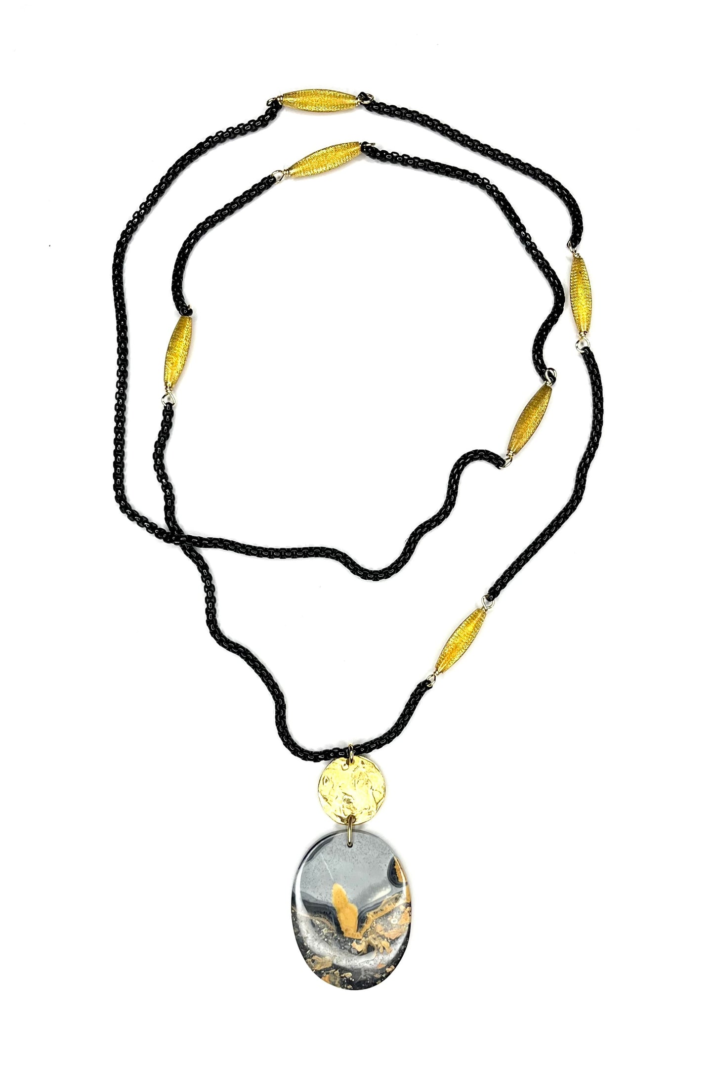 Pendant necklace featuring Bumblebee Jasper, and black enamel chain that is channel set with vintage gold beads.